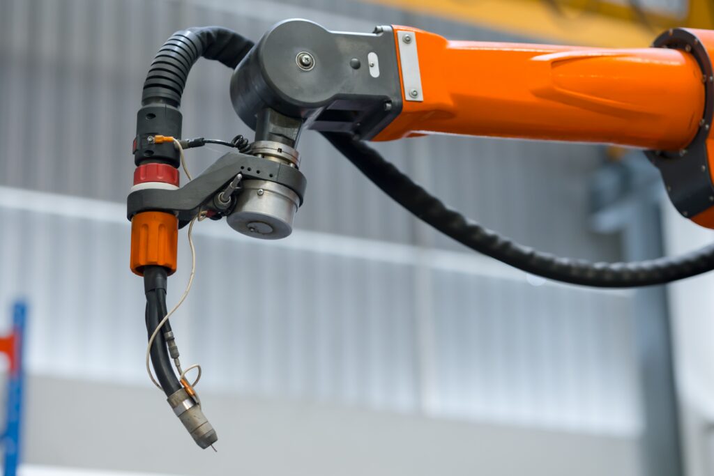 Close-up of robotic welding head performing automated welding